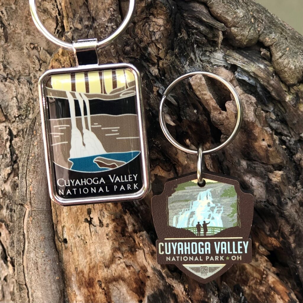 A photo of two Cuyahoga Valley National Park keychains depicting waterfalls. 