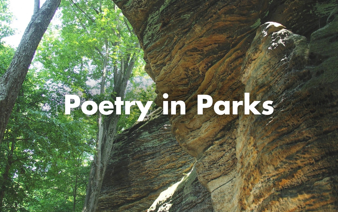 A photo of large stone formations in a forest with the words Poetry in Parks overlaid on top.