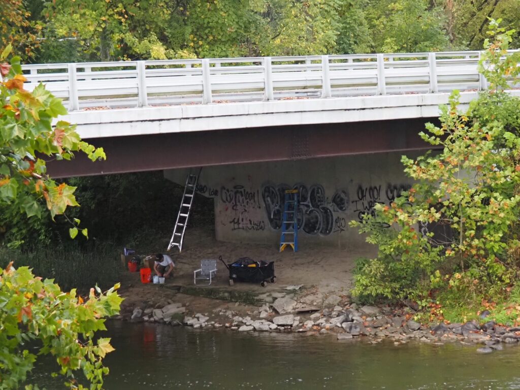 Arlin beginning work under the bridge