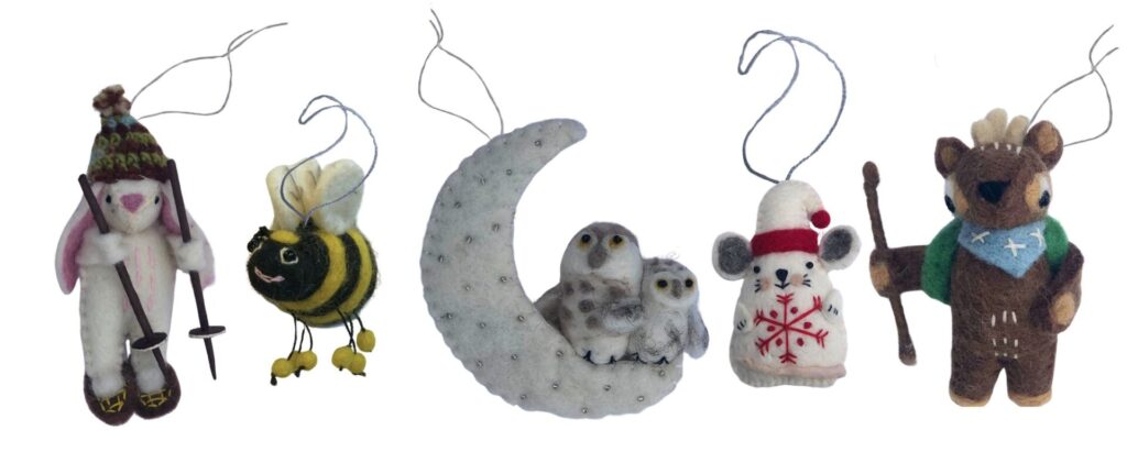 A graphic displaying five felted ornaments in the following designs: a snowshoeing rabbit, a bumblebee, two owls on a crescent moon, a mouse in a stocking cap, and a deer wearing a backpack and holding a hiking stick.