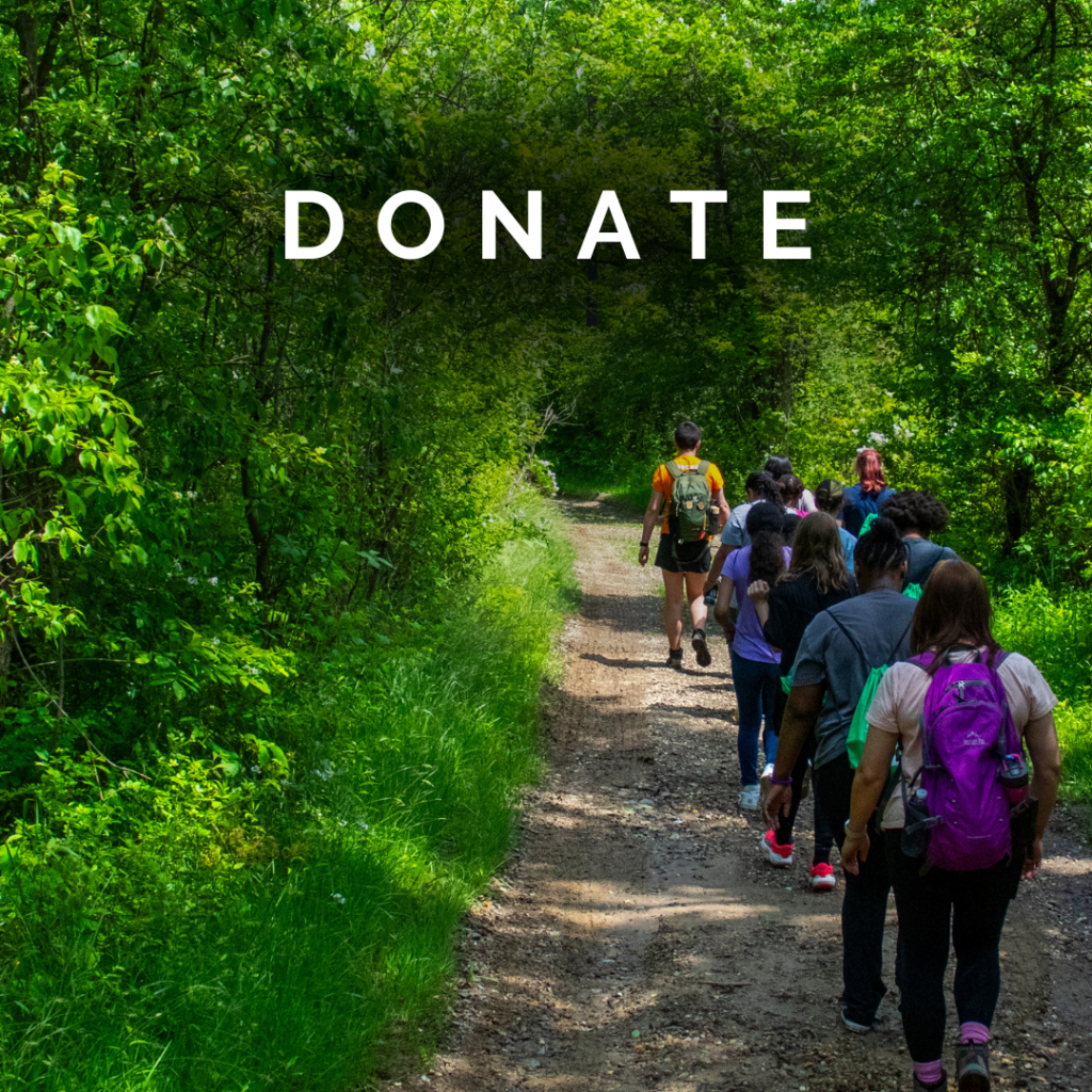 Group of students walking along a trail at Cuyahoga Valley Environmental Education Center