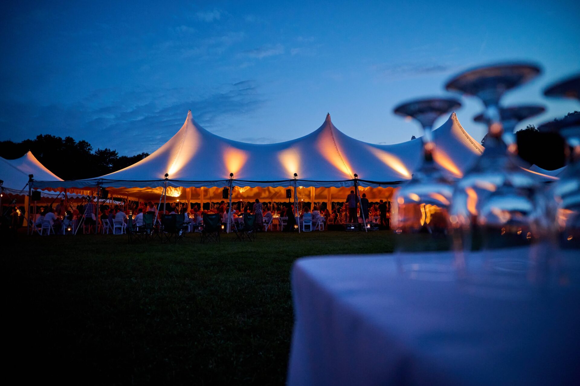 Tent with wine glasses in the foreground at Topography.